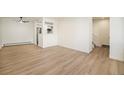 Bright living room with light wood floors and a ceiling fan at 1113 W 112Th Ave # B, Denver, CO 80234