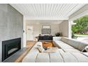 Modern living room featuring a fireplace, ample seating, and updated decor at 1440 S Clermont St, Denver, CO 80222