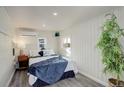 Calm bedroom with a comfortable bed, mini split unit, and soothing decor for restful nights at 4835 Grove St, Denver, CO 80221