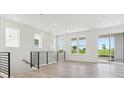 Open concept living area with hardwood floors and natural light at 11475 E Briarwood Cir, Centennial, CO 80112
