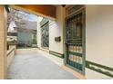 Inviting front porch with classic architectural details and a secure decorative security door for added charm at 2227 N Gilpin St, Denver, CO 80205