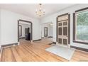 Bright and airy living room featuring hardwood floors, neutral paint, and ornate architectural details at 2227 N Gilpin St, Denver, CO 80205