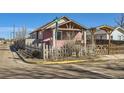 Charming single-story home featuring a quaint fence, porch entry, and well-maintained exterior at 101 2Nd St, Fort Lupton, CO 80621