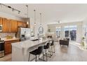 Bright, open-concept space with modern kitchen island, fireplace and comfortable living area at 10176 Park Meadows Dr # 2408, Lone Tree, CO 80124
