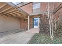 Front entry of townhome, showcasing brick facade and steps leading to the entrance at 1518 Chambers Dr, Boulder, CO 80305