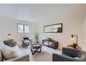 Bright living room featuring comfy seating, a coffee table, and stylish decor at 1518 Chambers Dr, Boulder, CO 80305