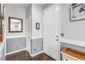 Welcoming foyer featuring hardwood floors, neutral paint, and an elegant design at 8321 E 33Rd Ave, Denver, CO 80238