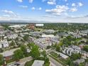Aerial view shows the property's location near Sloan Lake and other housing developments at 1711 Hooker St # 2, Denver, CO 80204