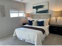 Inviting main bedroom with plush bedding, soft carpet, decorative lighting, and stylish decor for a restful retreat at 1711 Hooker St # 2, Denver, CO 80204