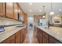 Modern kitchen with granite countertops and stainless steel appliances at 3995 Manorbrier Cir, Castle Rock, CO 80104