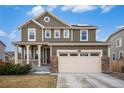 Traditional two-story home with a covered porch, two-car garage, and neatly manicured landscaping at 16317 Saint Paul St, Thornton, CO 80602