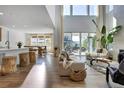 An open floor plan featuring high ceilings, and large windows allowing lots of natural light and an adjacent dining area at 11299 Star Streak Ln, Littleton, CO 80125