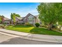 Lovely single-story home with manicured lawn and mature trees at 4532 Christensen Cir, Littleton, CO 80123