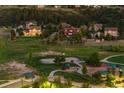 This image showcases a vibrant neighborhood with a playground, basketball court and open green spaces at 5605 Killen Ave, Castle Rock, CO 80104