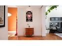 Stylish hallway with hardwood floors and modern art creating an inviting atmosphere at 421 Dexter St, Denver, CO 80220