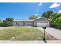 Charming ranch-style home with well-maintained lawn and two-car garage at 4844 E 110Th Pl, Thornton, CO 80233
