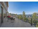 Inviting outdoor deck with seating and stunning mountain views from every vantage point at 12933 Upper Ridge Rd, Conifer, CO 80433