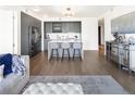 Open concept kitchen and living area with hardwood floors at 1750 Wewatta St # 1521, Denver, CO 80202