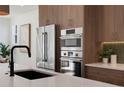 Close-up of the kitchen's stainless-steel appliances and sleek countertops at 2450 S Cherokee St, Denver, CO 80223