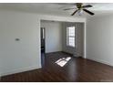 Bright living room with hardwood floors, fresh white paint, and natural light at 1120 Dayton St, Aurora, CO 80010