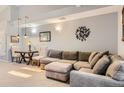 Inviting living room showcasing the plush sectional sofa, neutral decor, and a cozy seating arrangement at 2800 W Centennial Dr # I, Littleton, CO 80123