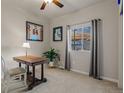 Cozy bedroom with neutral walls features a ceiling fan and a view of the neighborhood at 4738 River Highlands Loop, Elizabeth, CO 80107