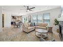 Spacious living room with an open layout, seamlessly connected to the dining and kitchen areas at 21434 E Greenwood Pl, Aurora, CO 80013