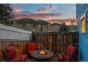 Backyard with a fire pit and seating area for outdoor relaxation with mountain views at 2041 Virginia St, Idaho Springs, CO 80452