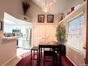 Inviting dining area complemented by modern appliances and bright lighting at 4933 S Carson St # 212, Aurora, CO 80015