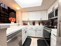 Bright kitchen with modern appliances and tile countertops at 4933 S Carson St # 212, Aurora, CO 80015