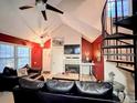 Cozy living room features a fireplace and ample natural light at 4933 S Carson St # 212, Aurora, CO 80015