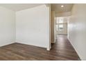 Bright entryway with laminate flooring and neutral paint, offering a clean, modern aesthetic at 760 N Deer Park St, Watkins, CO 80137