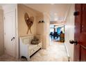 Inviting entryway with a decorative bench, stone floors, and mountain decor at 765 Columbine St # C203, Breckenridge, CO 80424