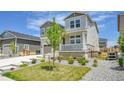 Lovely two-story home with a charming front porch and manicured front yard offering curb appeal at 3888 Grand Baker St, Aurora, CO 80019