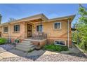 This lovely brick home features a cozy front porch and meticulous landscaping at 3818 W 25Th Ave, Denver, CO 80211