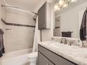 Modern bathroom features a shower-tub combination and granite vanity top at 13645 E Yale Ave # C, Aurora, CO 80014