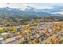 Picturesque aerial view of the town with mountain range and colorful fall foliage at 224 S Ridge St, Breckenridge, CO 80424