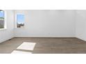 Bright, empty bedroom with wood floors and a window at 5625 W 141St Ln, Broomfield, CO 80020