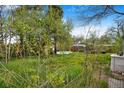Backyard view features abundant greenery and a stock tank pool, offering a relaxing outdoor space at 4730 Pierce St, Wheat Ridge, CO 80033