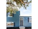 Charming home features a modern front door, neat landscaping, and freshly painted exterior at 10024 Holland Ct, Broomfield, CO 80021