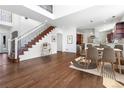 Spacious dining area with hardwood floors, staircase, and kitchen access, perfect for entertaining at 1204 S Balsam Ct, Lakewood, CO 80232