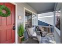 Relaxing front porch with comfortable seating and a charming, welcoming atmosphere at 1188 Mulberry Ln, Highlands Ranch, CO 80129
