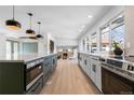 Modern kitchen with stainless steel appliances and an open floor plan at 7628 S Cedar Cir, Littleton, CO 80120