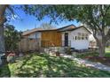 Attractive exterior view of the property showcasing fresh paint, curb appeal and an inviting entry at 3469 Benton St, Wheat Ridge, CO 80212