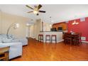 Open concept living and dining area with hardwood floors and kitchen at 17346 Nature Walk Trl # 108, Parker, CO 80134