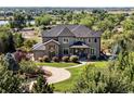 Charming two-story home with a well-manicured lawn and inviting entryway at 12648 Waterside Ln, Longmont, CO 80504