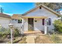 Inviting front porch with brick-paved landing, detailed trim, and clear house number display at 2171 S Cherokee St, Denver, CO 80223