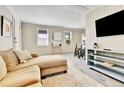 Bright living room with a comfortable chaise lounge and an entertainment area at 2171 S Cherokee St, Denver, CO 80223