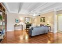 Cozy living space with hardwood floors, fireplace, and custom built-in shelving at 7877 E Mississippi Ave # 208, Denver, CO 80247