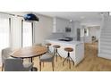 Bright, open kitchen boasts marble countertops and stainless steel appliances at 115 W 2Nd Ave # 101, Denver, CO 80223